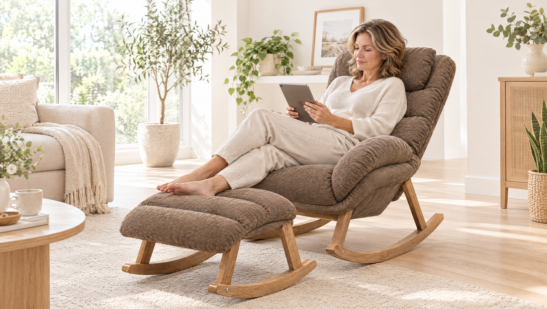 Woman reading a tablet in a high-back rocker with her feet up on the matching footrest