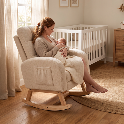 Mother holding her baby, in The Posy Tufted Teddy Nursing Rocker, Hidden Footrest in a bright nursery