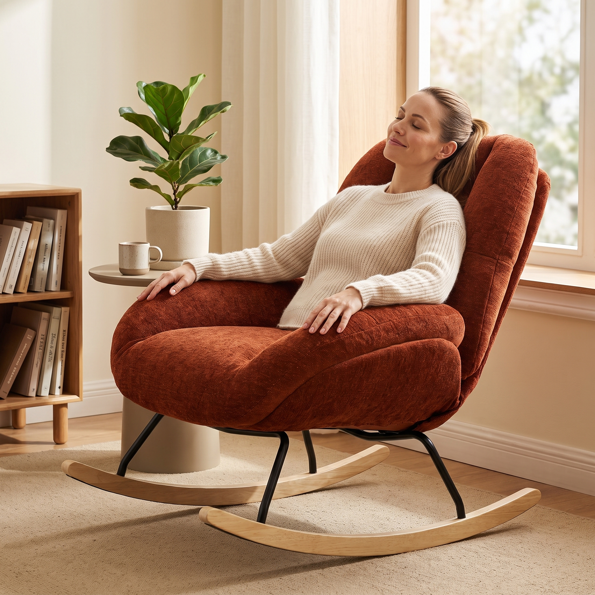 Woman relaxing, in The Ember Chenille Lounge Rocker in a sunlit reading corner