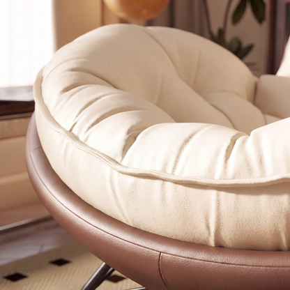 Close-up of The Truffle: button tufting and curved shell edge