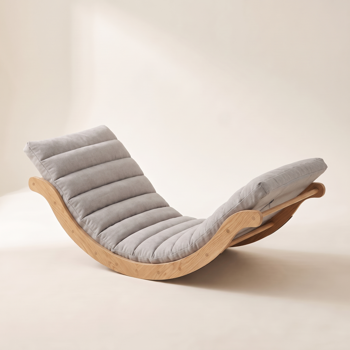 The Crescent curved wood floor rocker in Stone Gray / Natural Oak, studio photo
