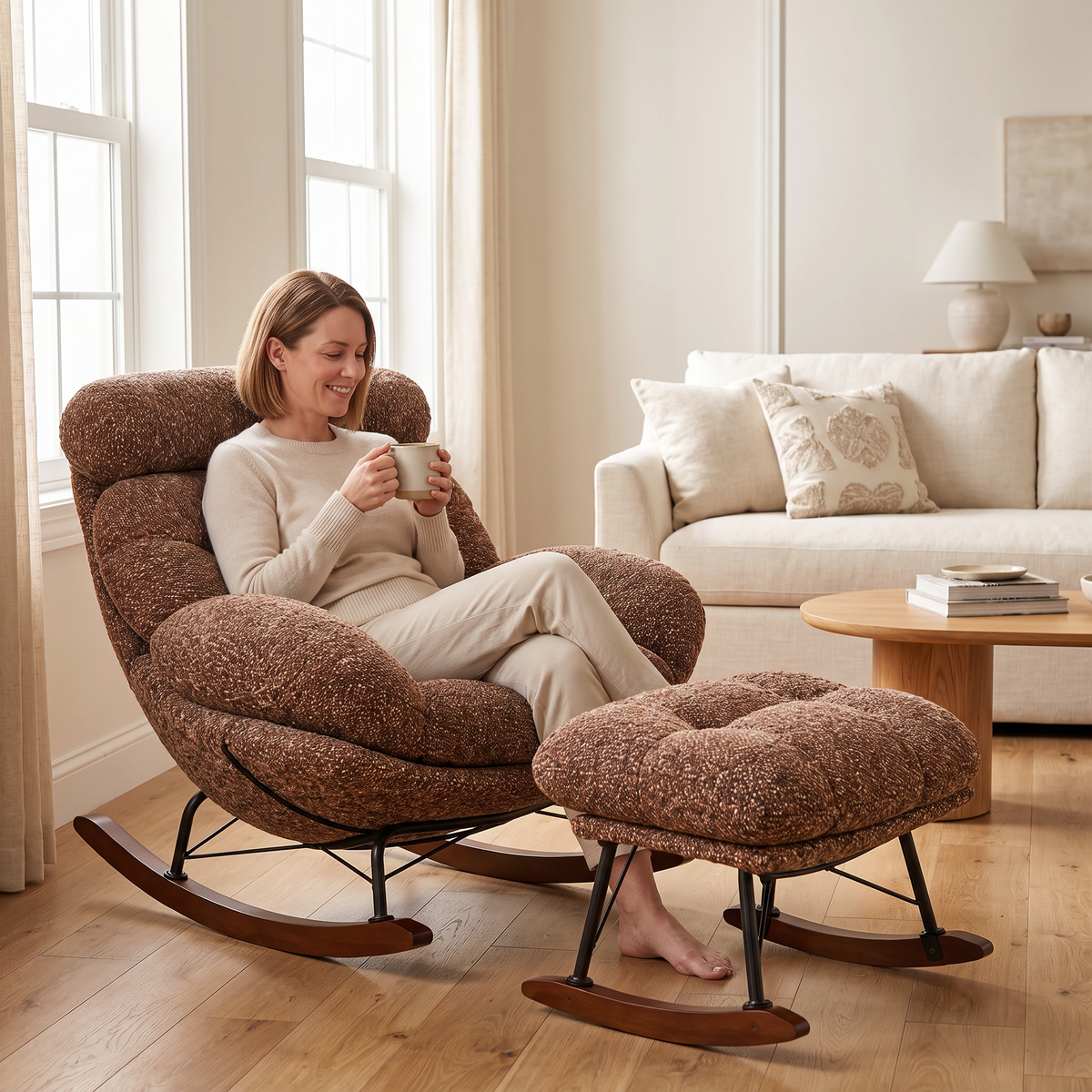 Woman relaxing, in The Bramble XXL Lounge Rocker + Ottoman in a sunny living room