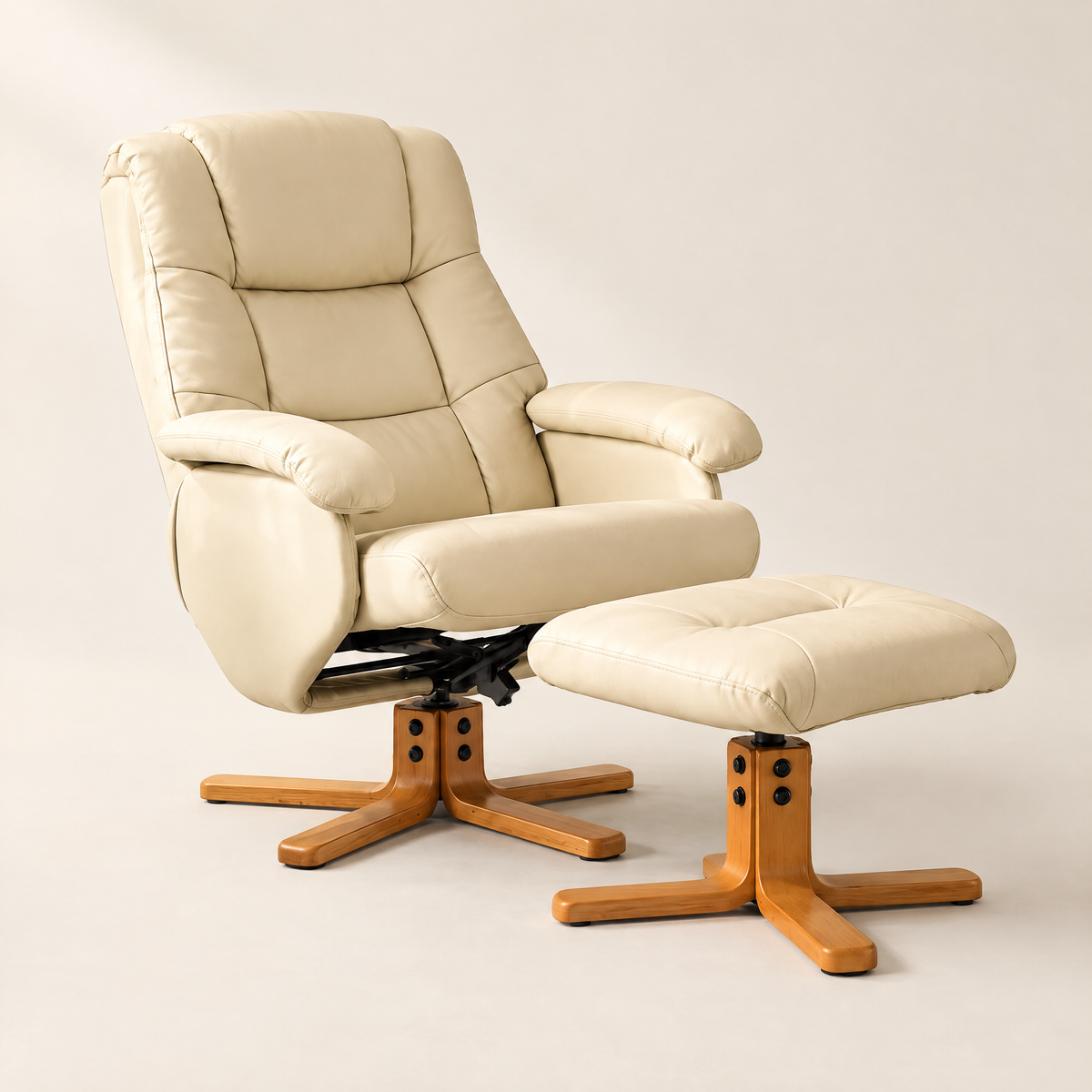 The Brighton faux leather swivel recliner + ottoman in Cream, studio photo
