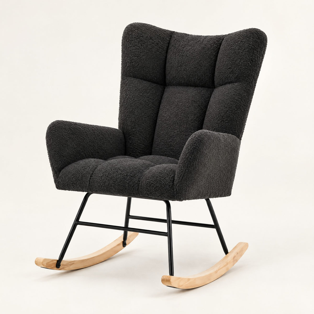 The Winslow boucle wingback rocker in Black, studio photo